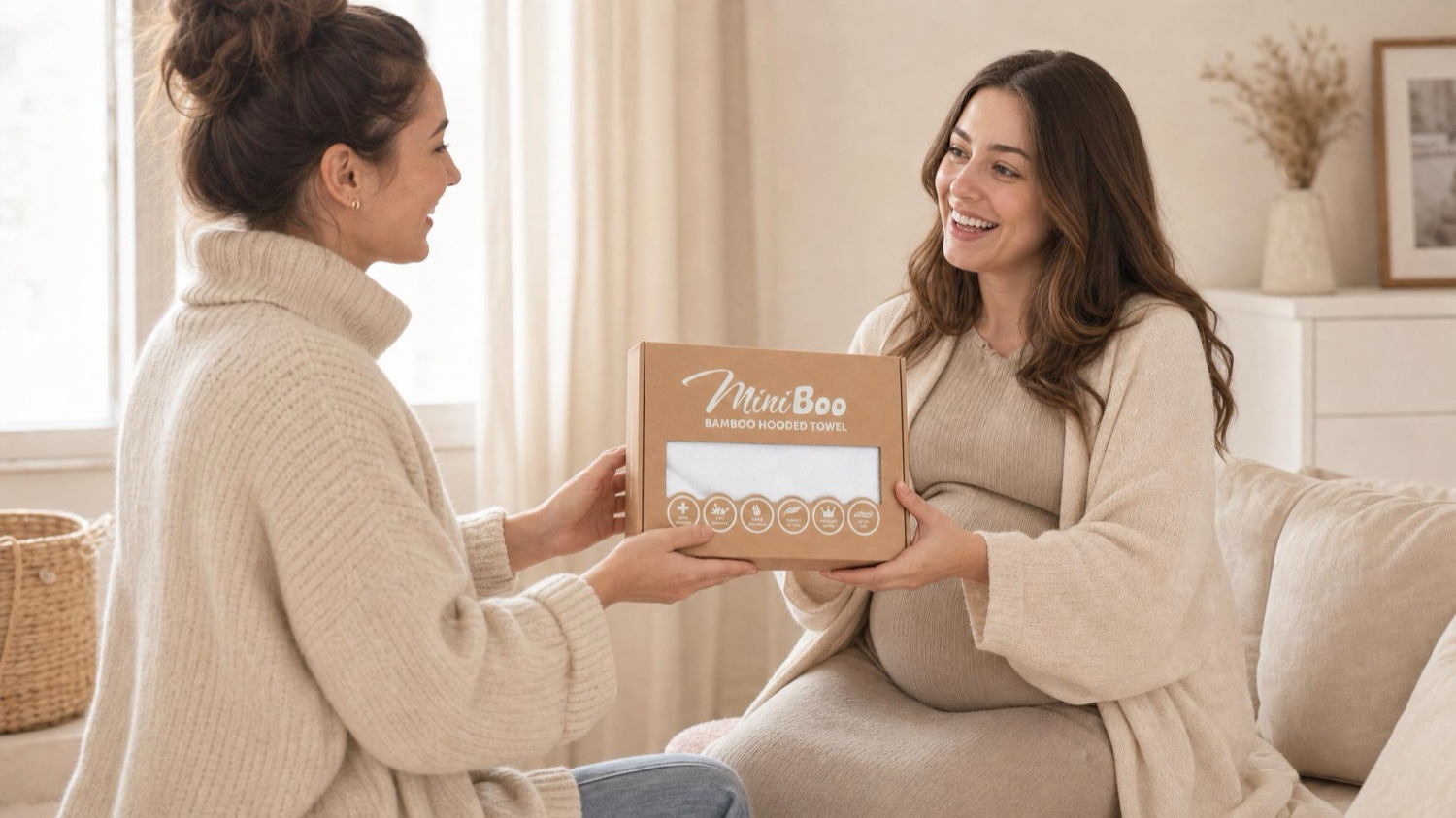 A mother handing a MiniBoo gift set to an expectant friend.
